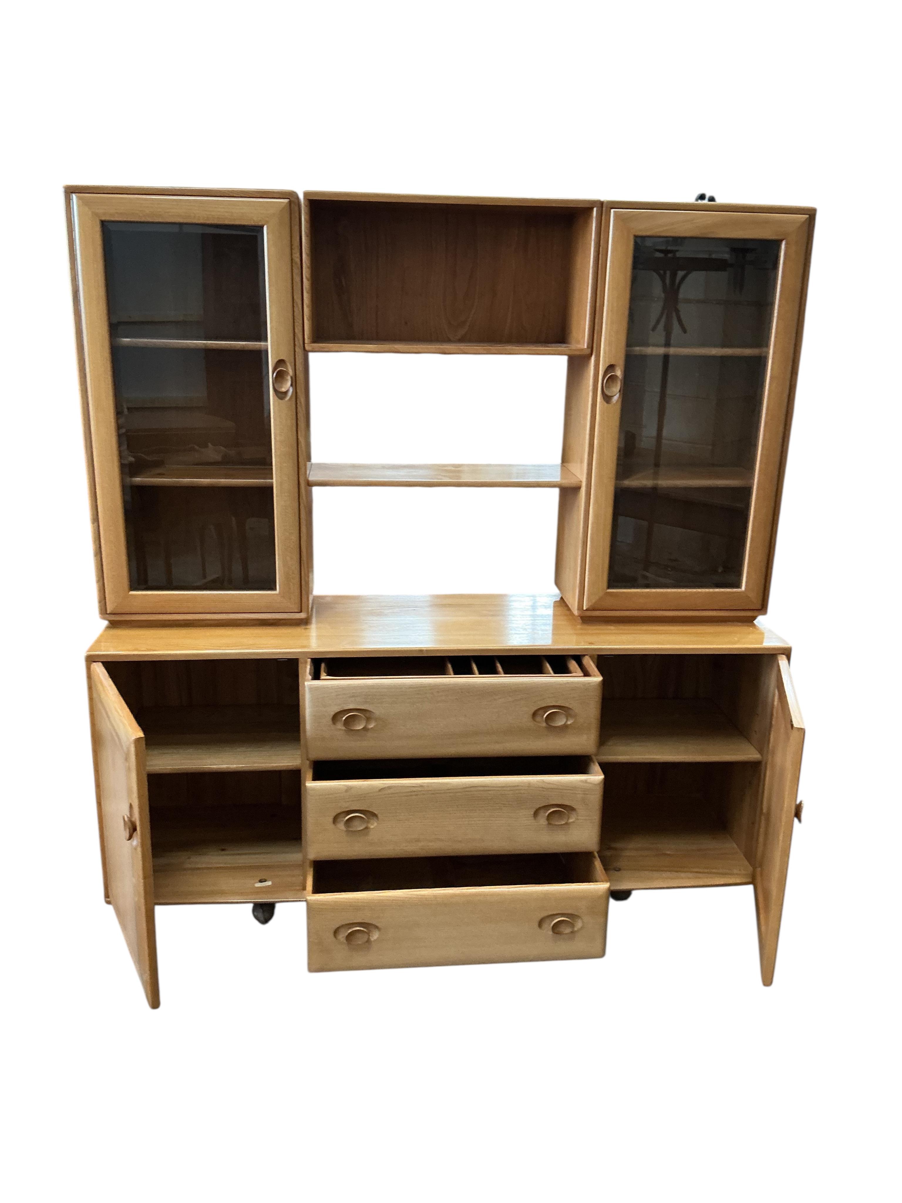 An Ercol Windsor light elm sideboard, width 155cm, depth 44cm, height 162cm